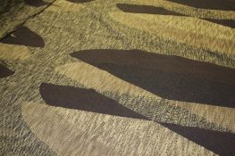 Two rolls of Edinburgh Weavers fabric `Amborna` pattern on a brown ground with geometric oval