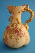 A Royal Worcester blush ivory jug decorated with enamel and gilt flowers, with gilt naturalistic