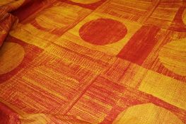 A bale of fabric Edinburgh Weavers, comprising 4 rows of red abstract patterned spheres on a burnt