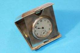 An engine turned silver folding travel clock, Chester 1924.