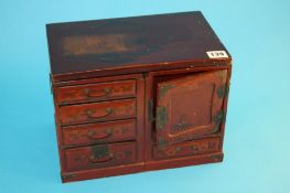 A small lacquered jewellery cabinet. 30 cm wide