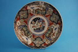 A late 19th century Japanese Imari wall plaque decorated with panels of flowers and birds. 37 cm