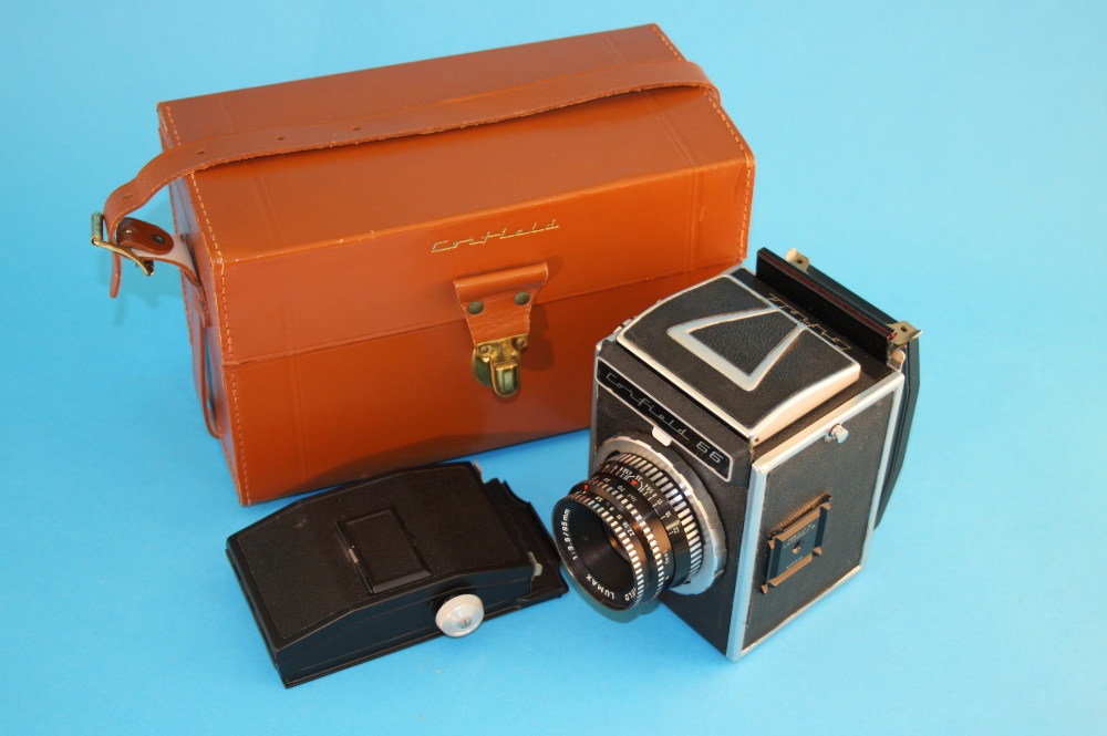A boxed Cornfield 66 plate camera.