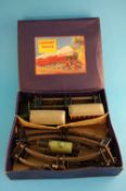 A boxed Hornby 0 gauge clockwork M1 passenger train set, and various boxed rolling stock signals