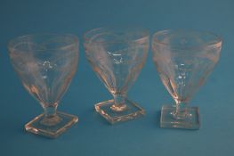 Three 19th century etched glass rummers on square bases.