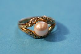A 9ct gold pearl and diamond ring.