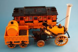 A Hornby 3.5 inch gauge live steam train set "Stephenson`s Rocket" together with G104 coach.