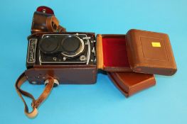 A Rolleicord camera 1927000 and case and two Thornton Pickard plate cameras etc.