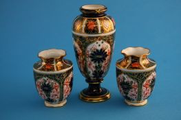 A Royal Crown Derby Imari spill vase and a small pair of Imari vases with flared rims, printed marks