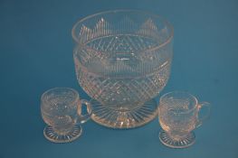 A hobnail cut glass punch bowl and 2 glasses.