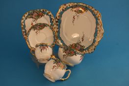 A Royal Albert Crown China tea set "Azalea" pattern comprising 2 sandwich plates, 12 side plates, 12