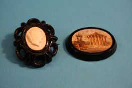 A small Italian micromosaic oval plaque and a Victorian oval brooch.
