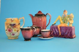 A Carlton ware "Jester" seated on a table and a Carlton ware "Rouge Royale" 6 piece coffee set and