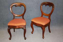 A near set of 8 Victorian mahogany balloon back dining chairs with drop in seats and serpentine