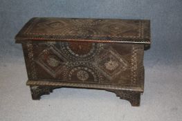 A small oak carved coffer. 92 cm long