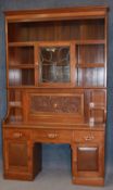 A late 19th early 20th century mahogany bureau bookcase with moulded cornice, five book recesses,