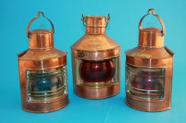 A pair of small copper ship`s lights "Port" and "Starboard" and a "Port"lamp. (3)21.5 cm high and