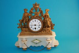 A late 19th century gilt metal and alabaster French clock with enamelled circular dial, under a