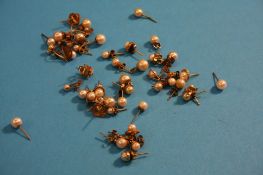 A quantity of gold mounted pearl earrings.