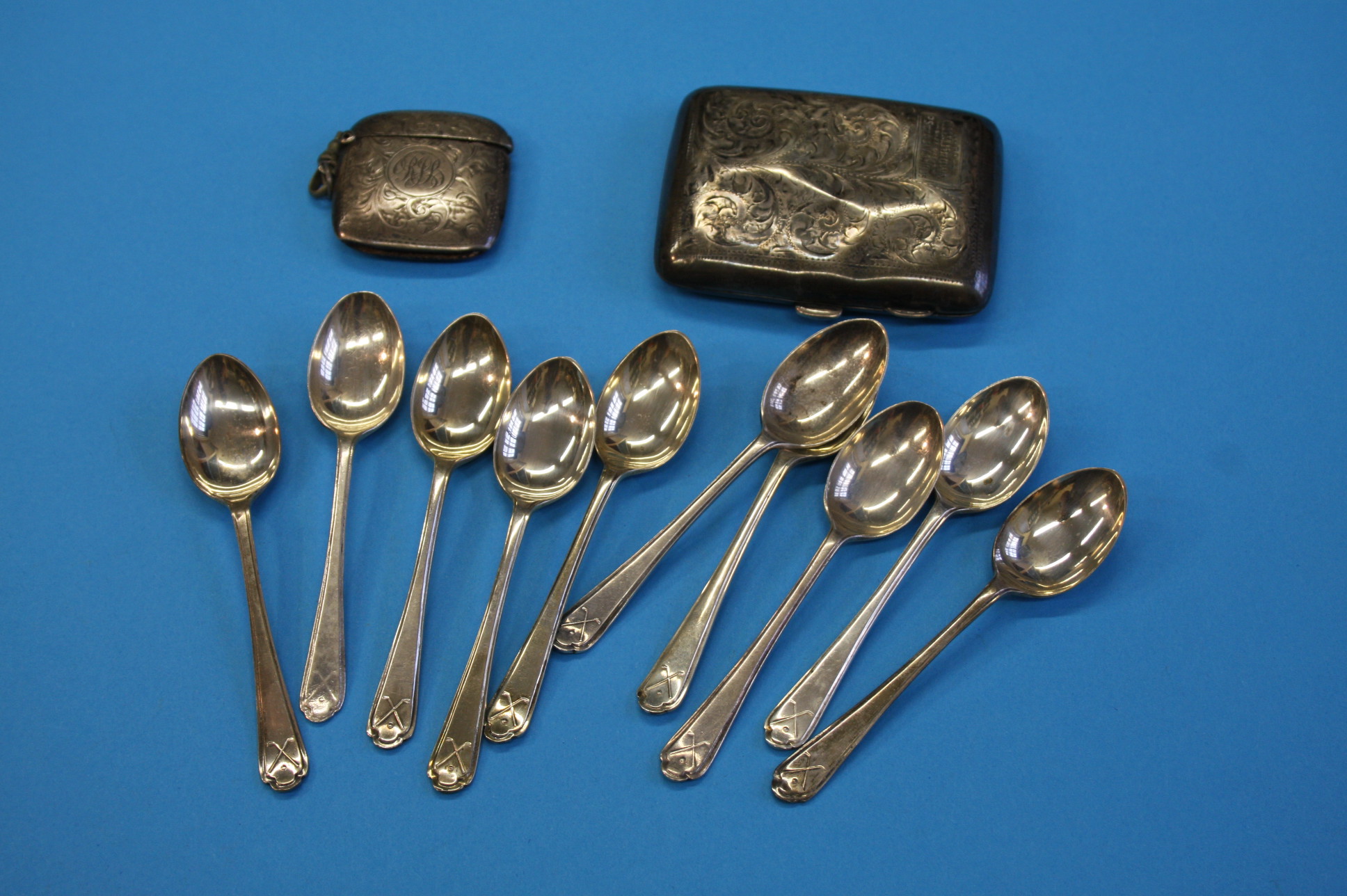 A silver cigarette case, a silver vesta and ten silver teaspoons.Total weight 7.2 oz