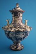 A large blue and white Royal Bonn vase and cover with two handles, waisted neck and decorated in