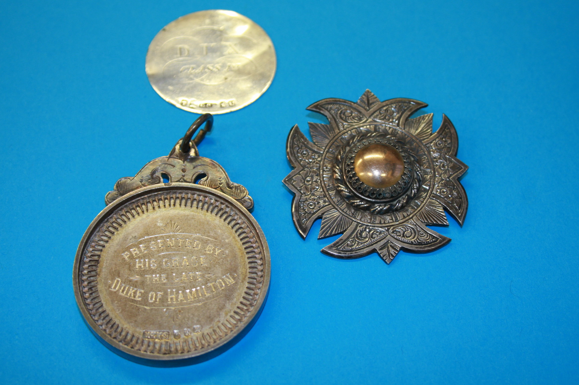 Three 19th century silver medals, "Hamilton Academy", "Plockton Public School" and "Lennox School