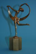 Joseph Lorenzl, a gilt bronze figure of a nude ballerina balancing on one foot with arms aloft,
