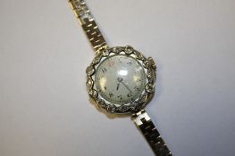 A ladies 9ct gold and diamond wristwatch.