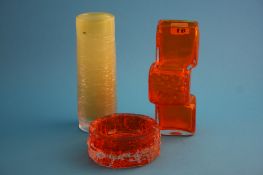 A Whitefriars "Drunken Bricklayer" tangerine glass vase; a tangerine Whitefriars ashtray and an