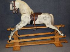 A rocking horse on pine stand by Haddon Rockers Makers and Restorers Wallingford Oxfordshire.