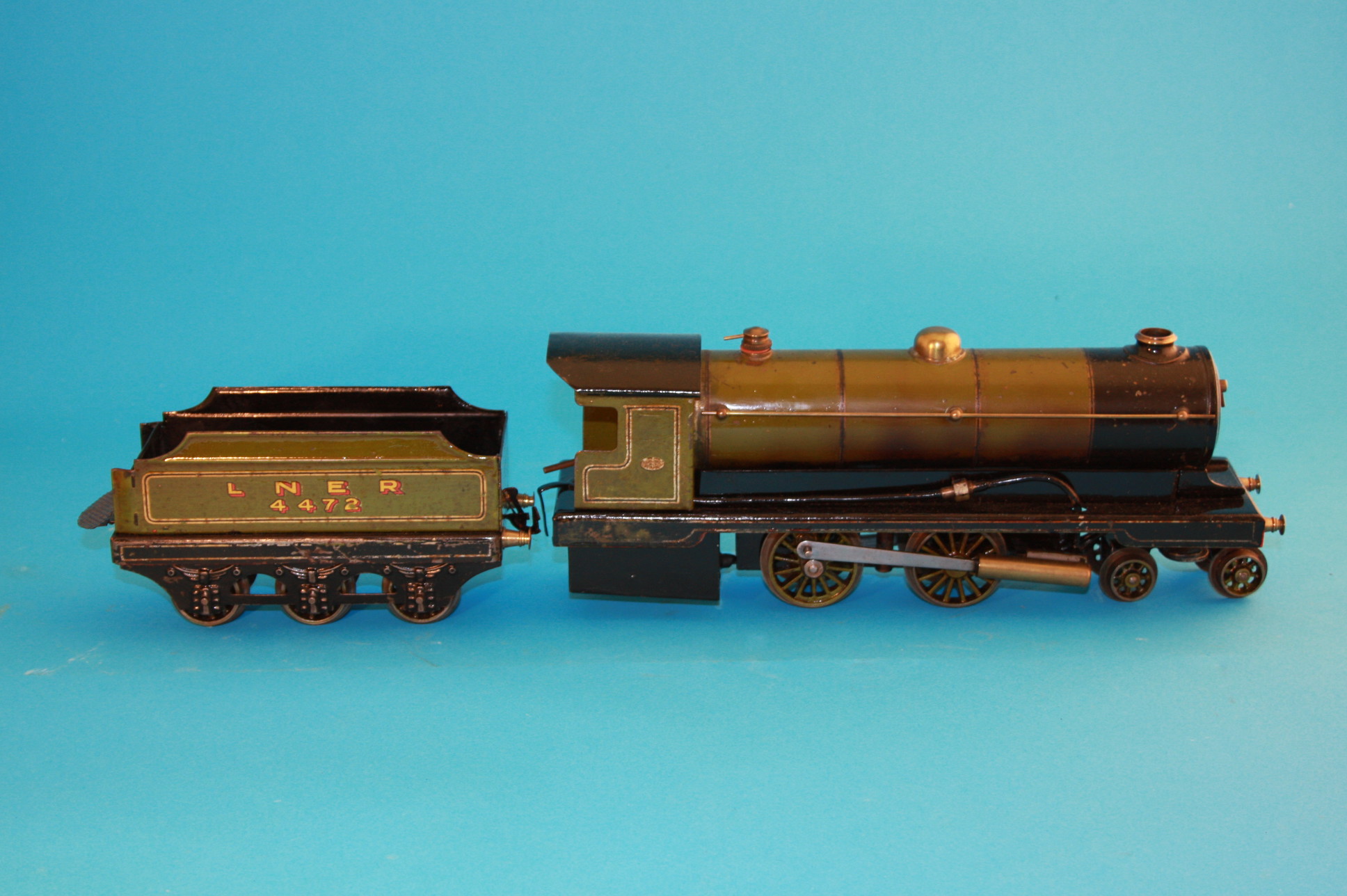 A Bowman model of a Dereham Norfolk "O" gauge spirit fired locomotive and tender in LMS green and