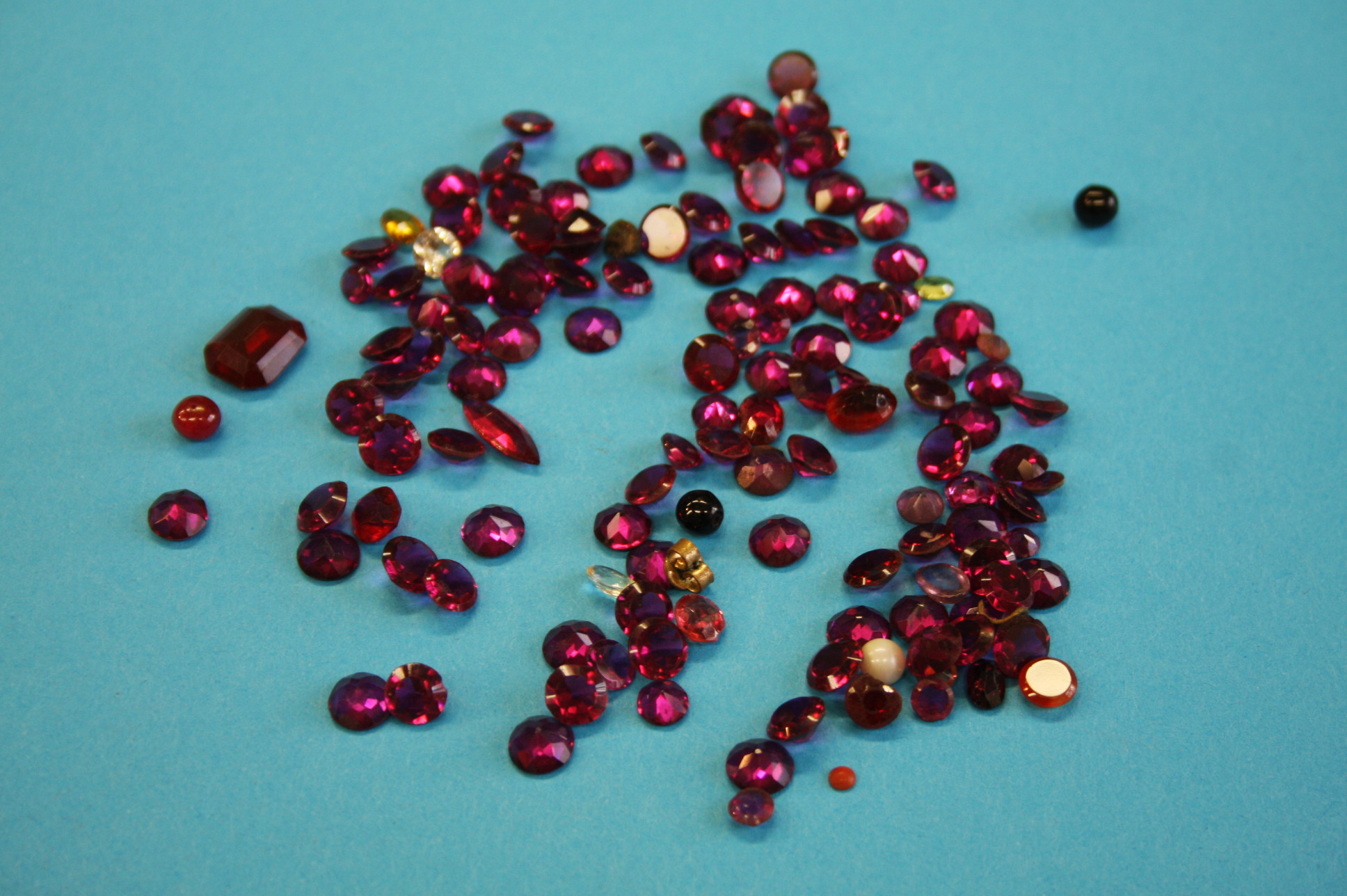 A bag of various garnets and other stones.