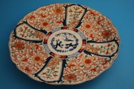 Two Japanese Imari circular wall plaques. 36.5 cm and 34 cm diameter