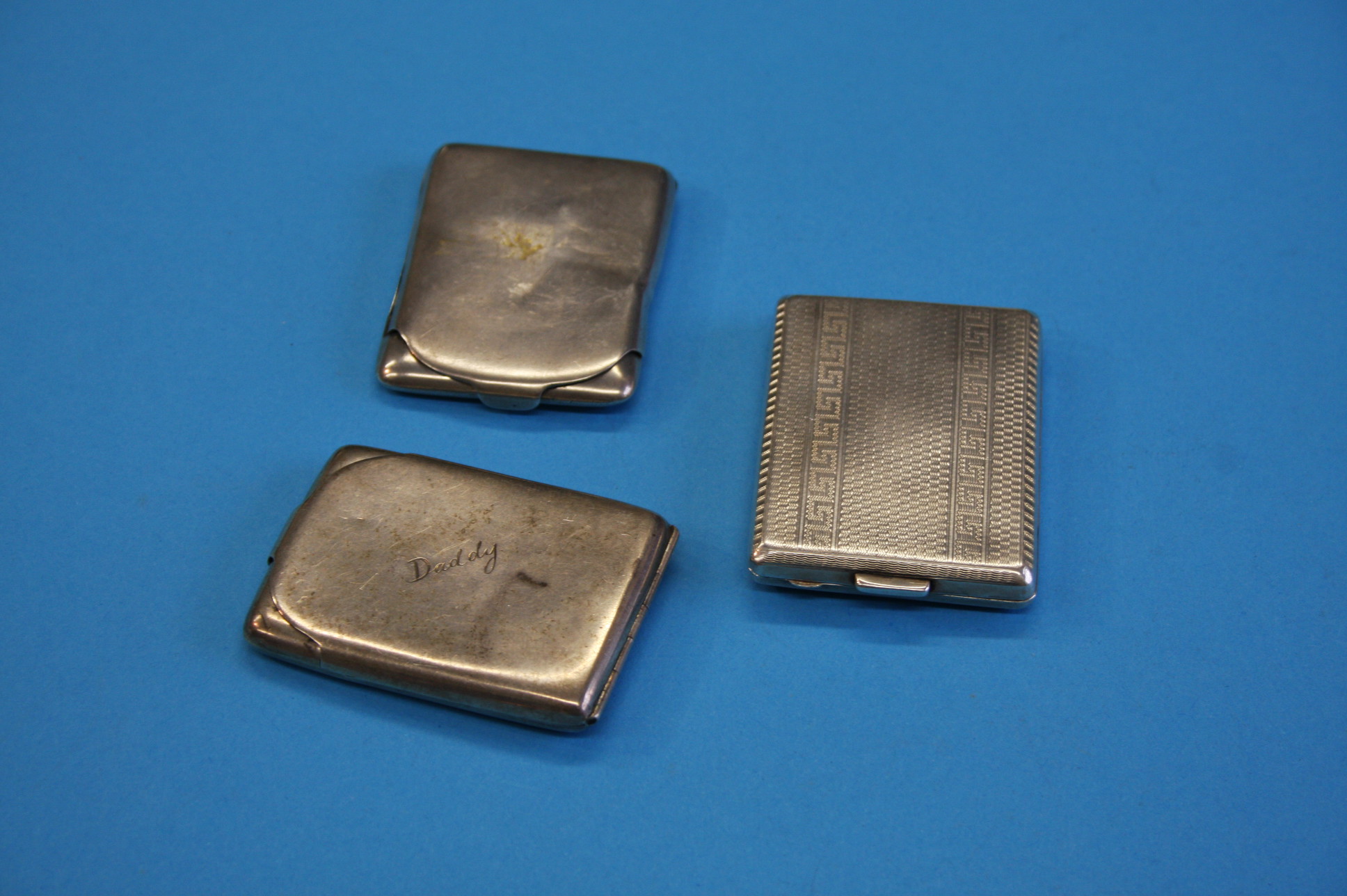 Three various silver calling card cases, all Birmingham, 1921, 1925 and 1931.Total weight 3.2 oz