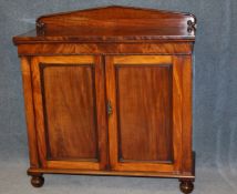 A 19th century mahogany chiffonier with raised back below single drawer and 2 panelled doors