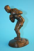 A spelter model of a boxer supported on an oval base. 25 cm high