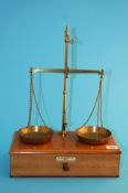 A set of 5 oz balance scales by De Grave Short & Co Ltd, Naylor Road, London; and four graduated