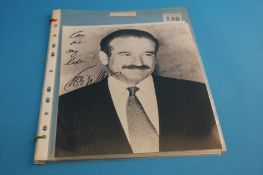 A collection of signed photographs and autographs to include Robin Williams, Christopher Reeve,