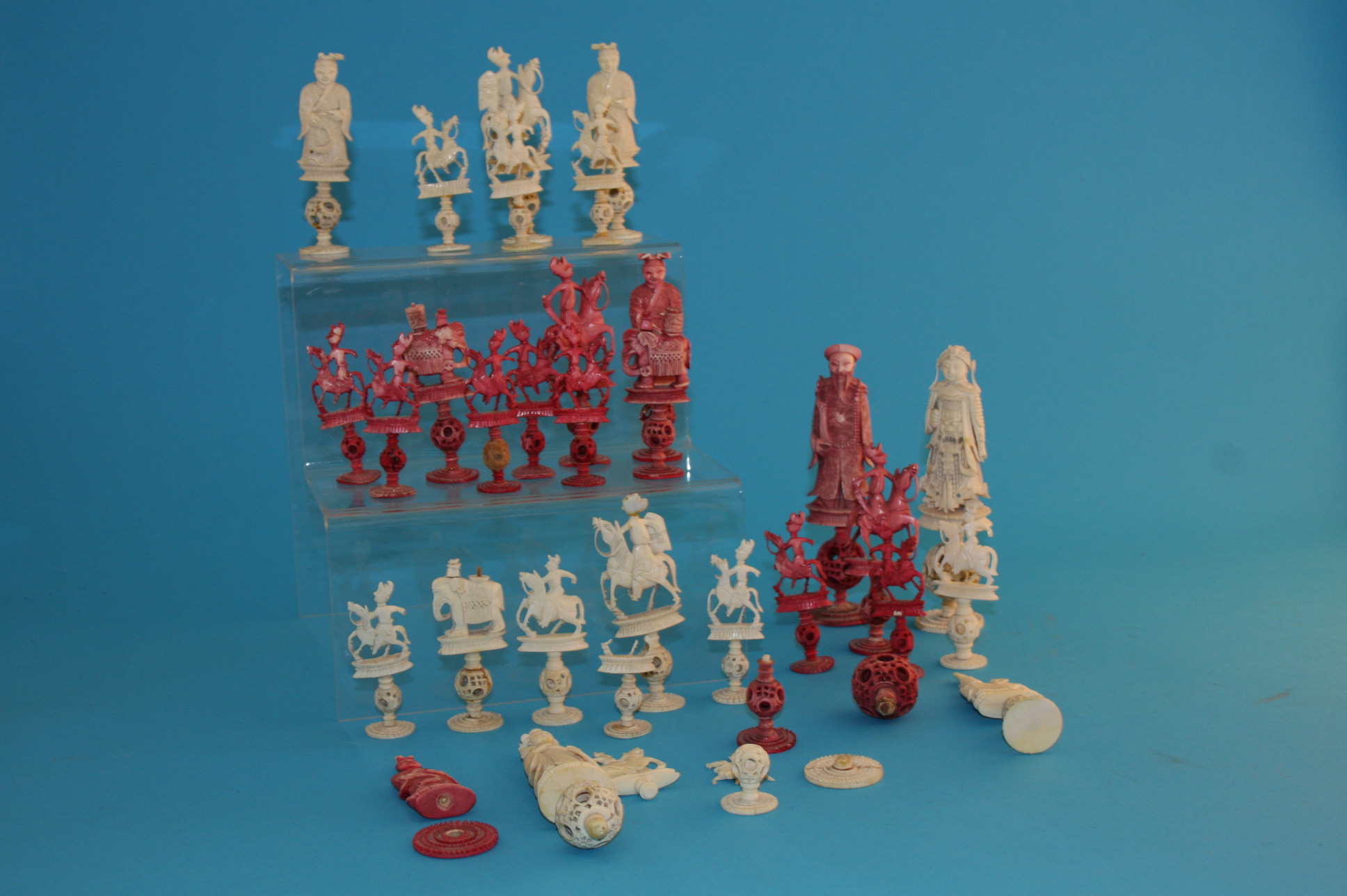 An early 20th century stained ivory oriental carved part chess set.