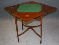 An Edwardian mahogany envelope card table with single drawer, supported on square tapering legs and