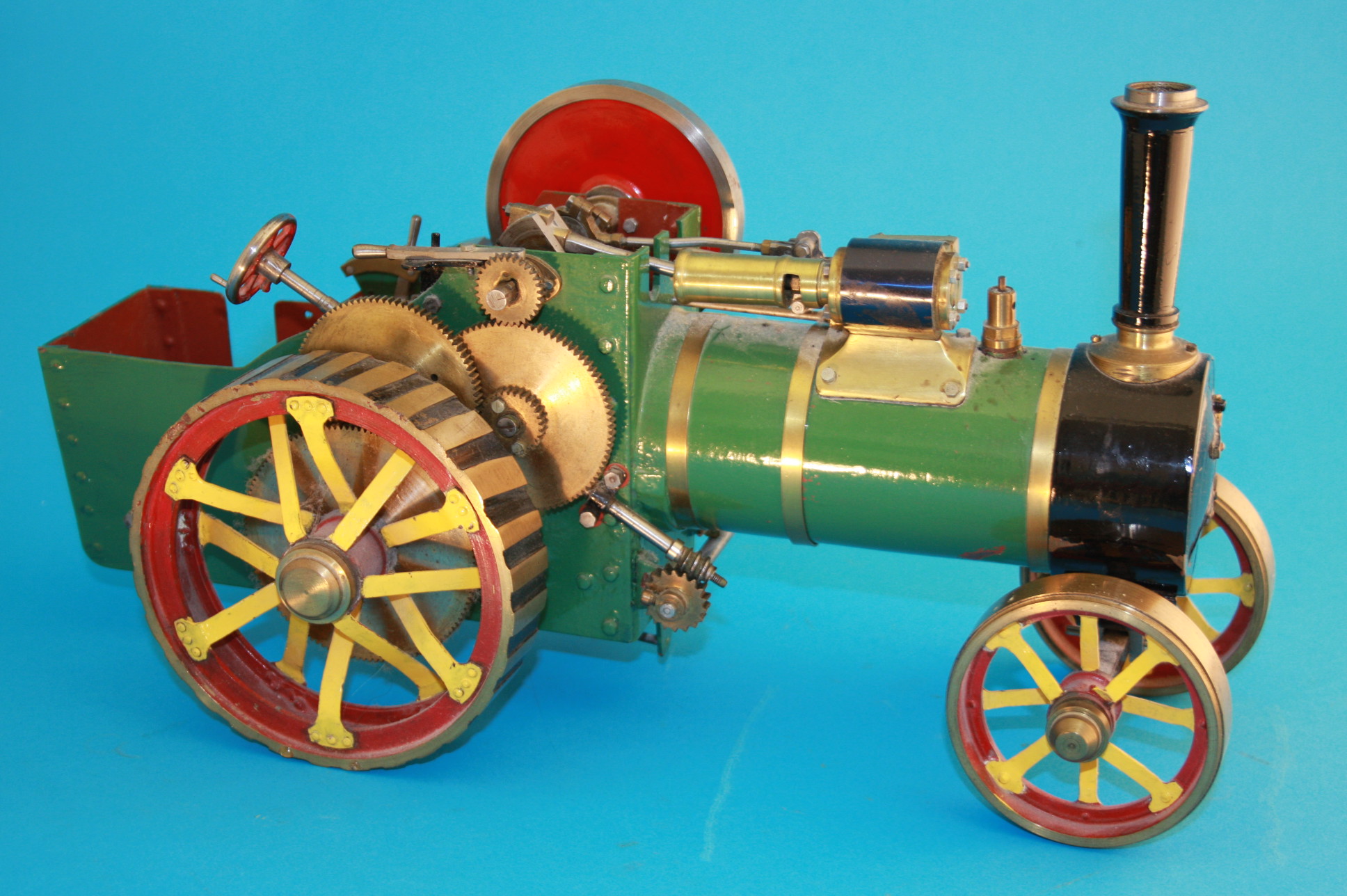 A scratch built model of a live steam traction engine. 40 cm long 17 cm wide 21 cm high (Please not