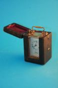 A small French carriage clock and case with silvered dial and strike action. 10.5 cm high