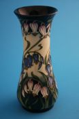 A modern Moorcroft vase on a cream and green ground decorated with harebells, printed mark.20.5 cm