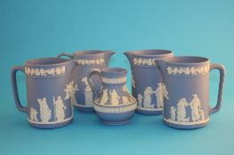 A set of 3 Wedgwood jasperware jugs and two other jugs. (5)