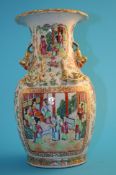 A Chinese Canton enamelled decorated vase decorated with two panels of figures, serpents and dogs