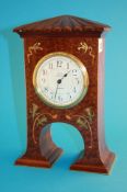 A mahogany cased Art Nouveau design brass and fruitwood inlaid mantle clock by Dent of London, with