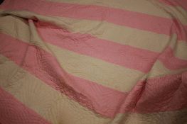 A Durham quilt with pink and white stripes and white reverse. 225 cm x 198 cm
