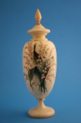 A Victorian yellow glass vase and cover, painted with enamel floral decoration.38 cm high