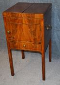 A Georgian mahogany washstand with fold over top, single door below a single drawer, supported on