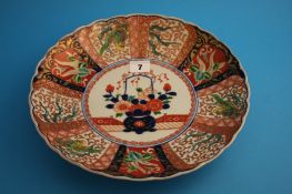 A Japanese Imari wall plate. 30 cm diameter